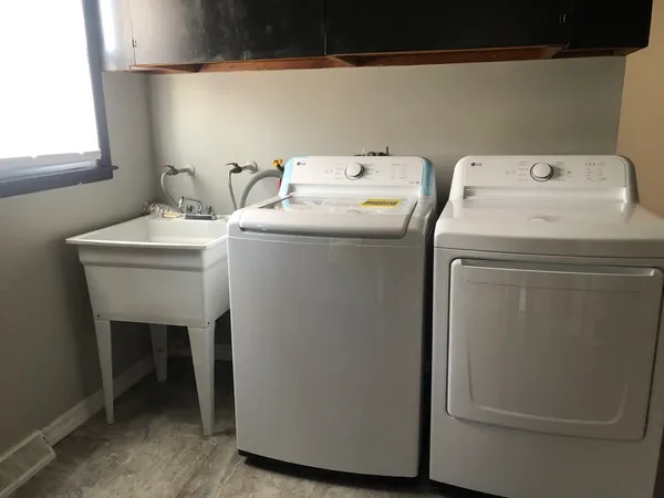 a utility room with dryer and washer