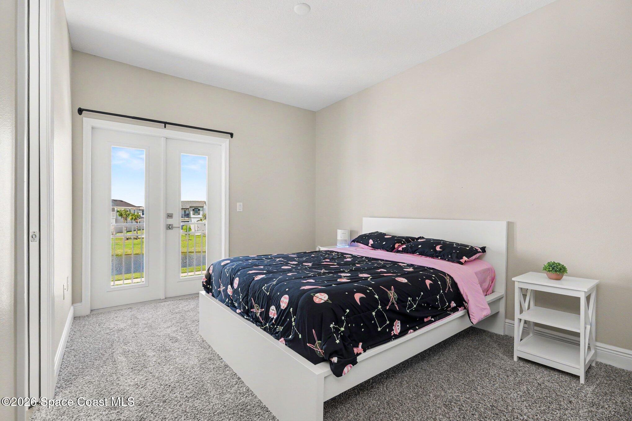 2467 Kola Way Melbourne, FL 32940 - Photo 31 of 36 Bedroom 4 with balcony and French doors