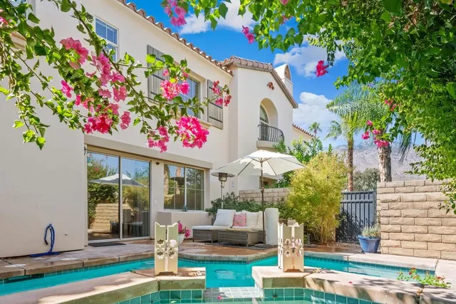 a front view of multi story residential apartment building with yard