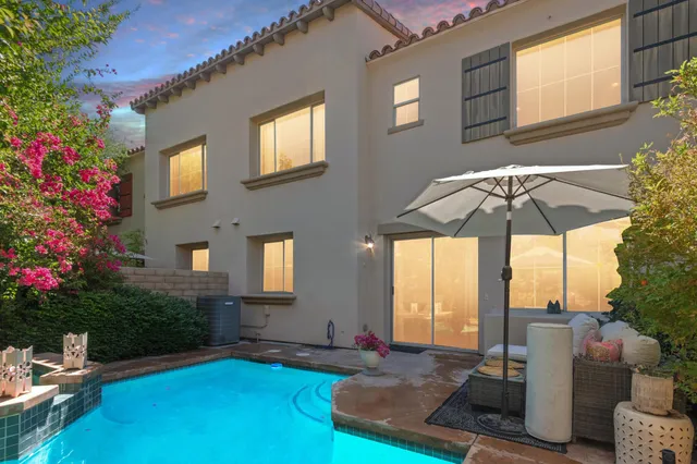 a view of an house with backyard porch and furniture
