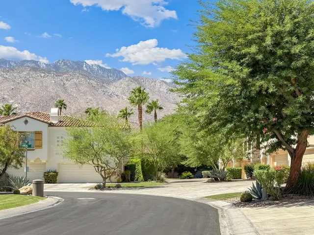 a view of a street with a building in the background
