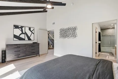 a bedroom with a bed and a dresser