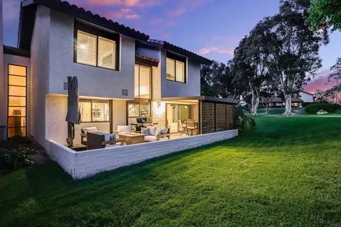 a view of a house with a yard porch and sitting area