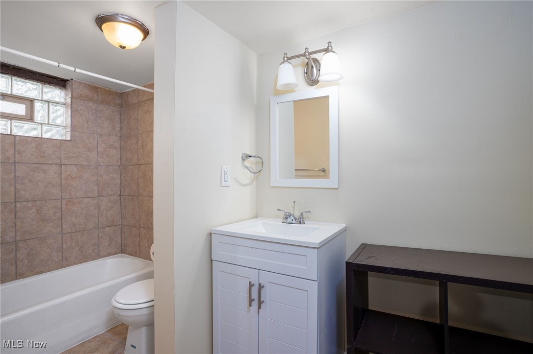 555 Brittain Road Akron, OH 44305 - Photo 23 of 26 Bathroom featuring shower / washtub combination, vanity, and tile patterned floors