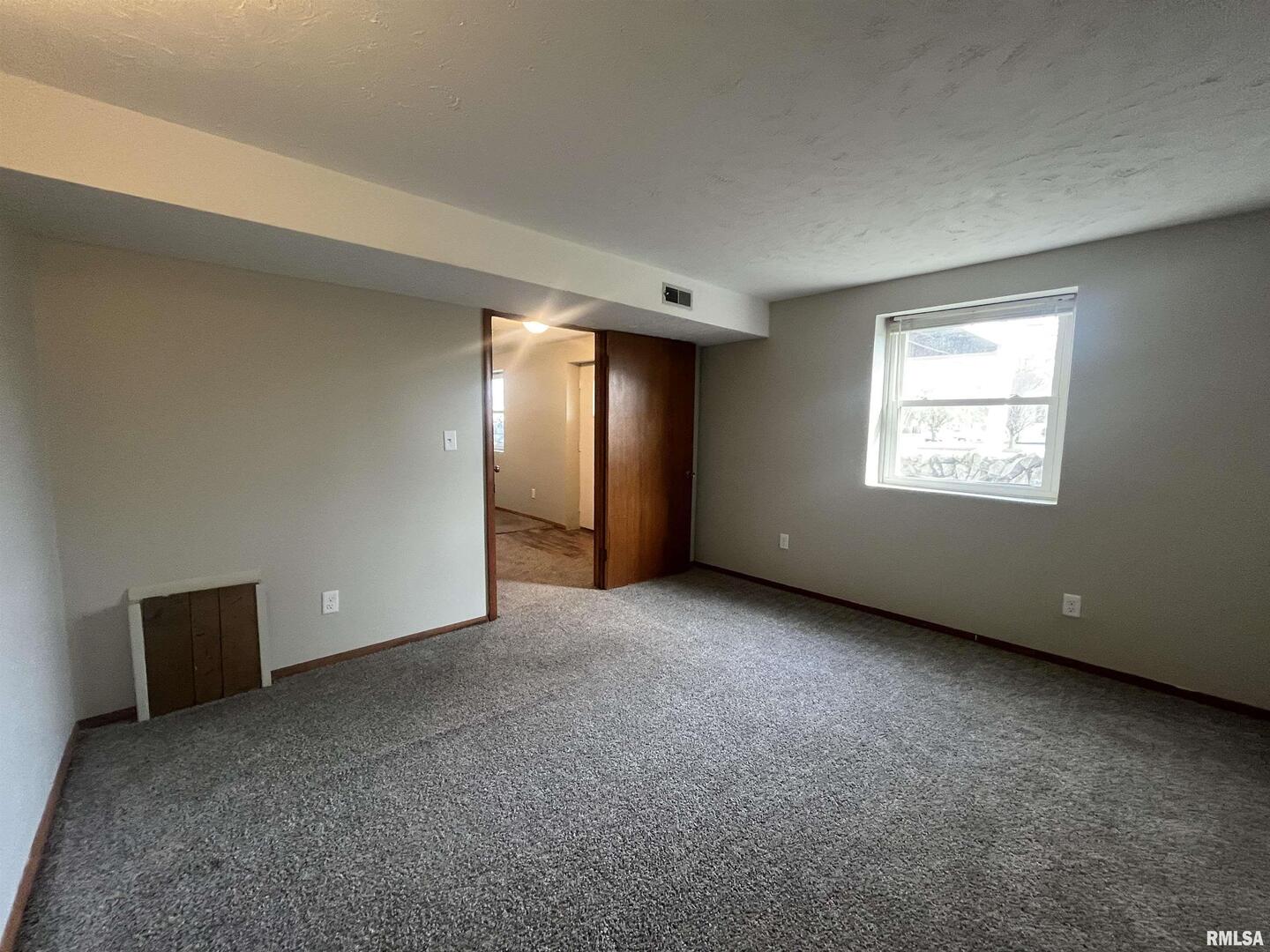 314 East 8th Street Metropolis, IL 62960 - Photo 28 of 33 a view of an empty room with a window