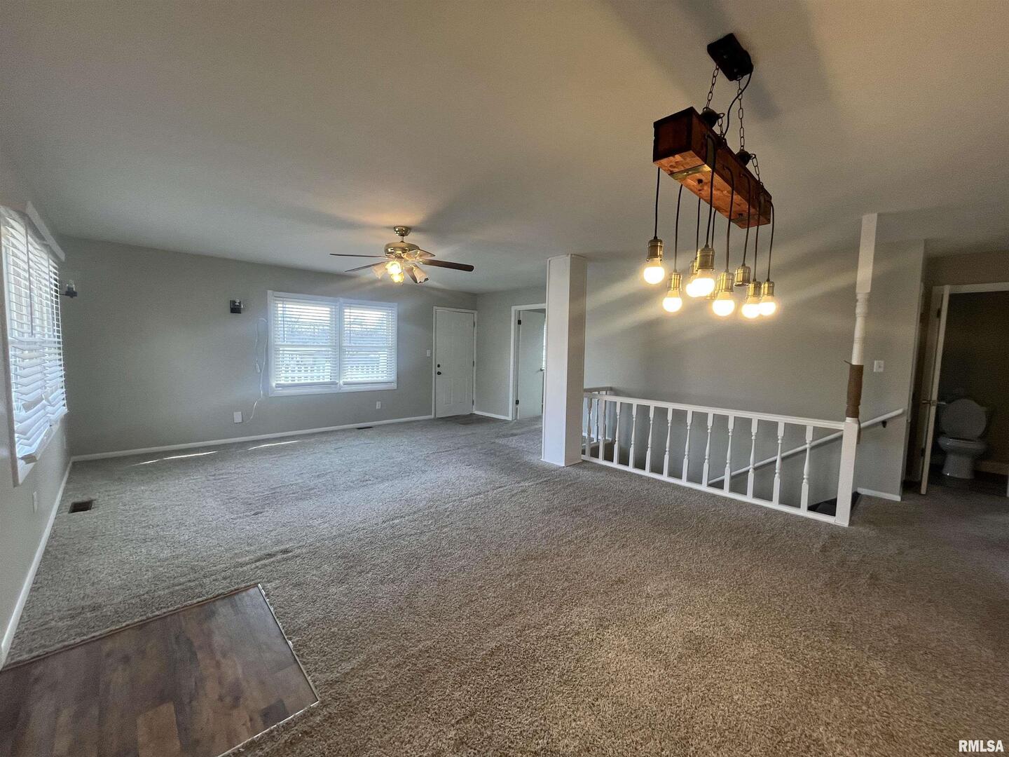 314 East 8th Street Metropolis, IL 62960 - Photo 7 of 33 a view of an empty room and chandelier fan