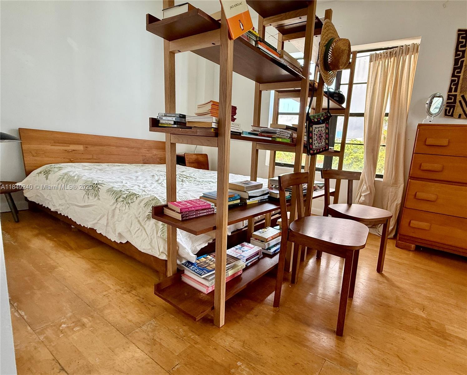 934 Michigan Avenue, Unit 304 Miami Beach, FL 33139 - Photo 16 of 30 a dining room with furniture and a table