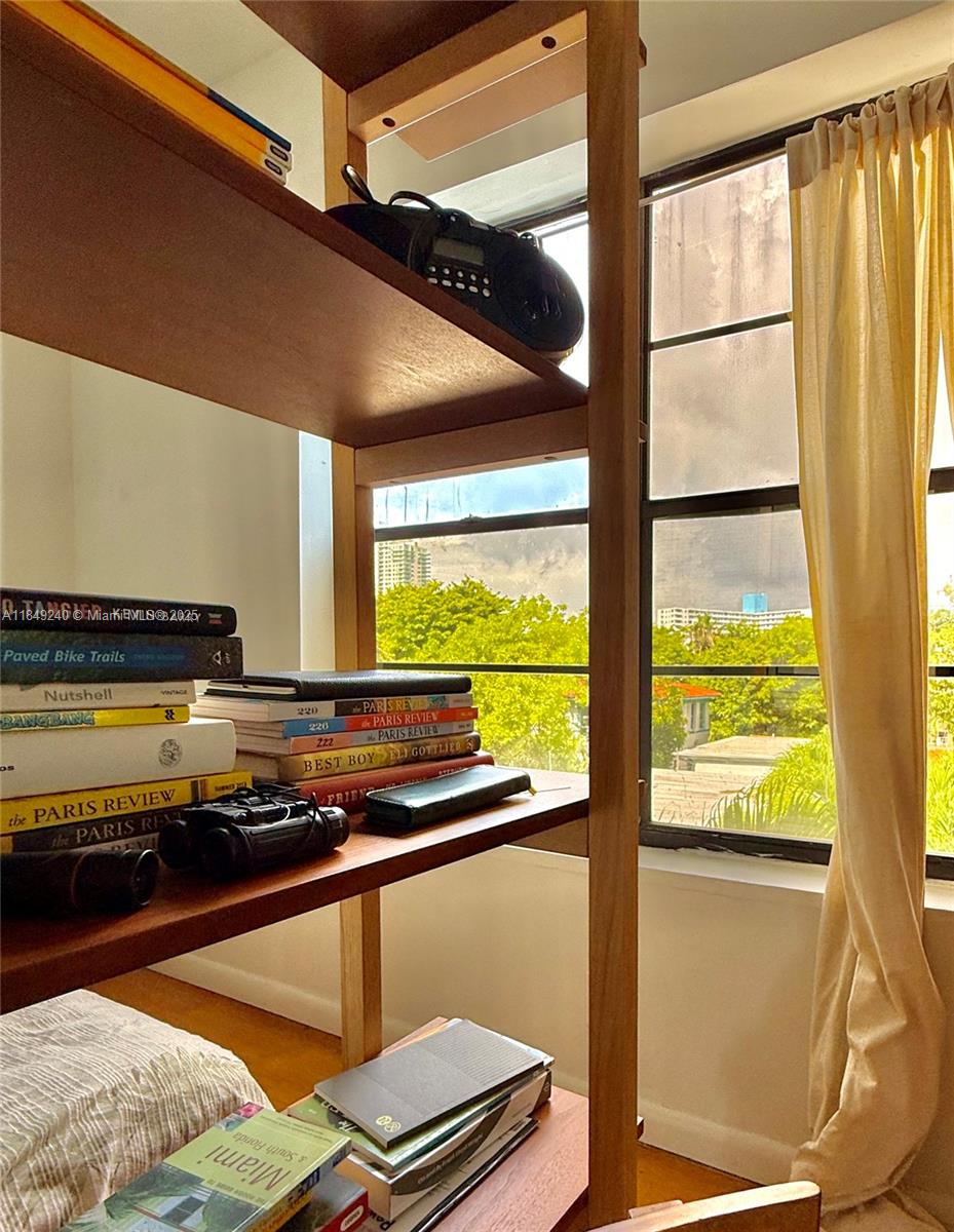 934 Michigan Avenue, Unit 304 Miami Beach, FL 33139 - Photo 19 of 30 a room with wooden floor and furniture