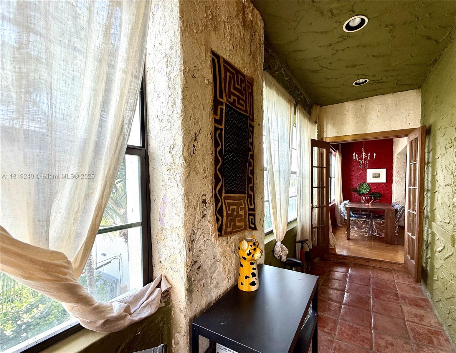 934 Michigan Avenue, Unit 304 Miami Beach, FL 33139 - Photo 20 of 30 a view of a dining room with furniture window and wooden floor