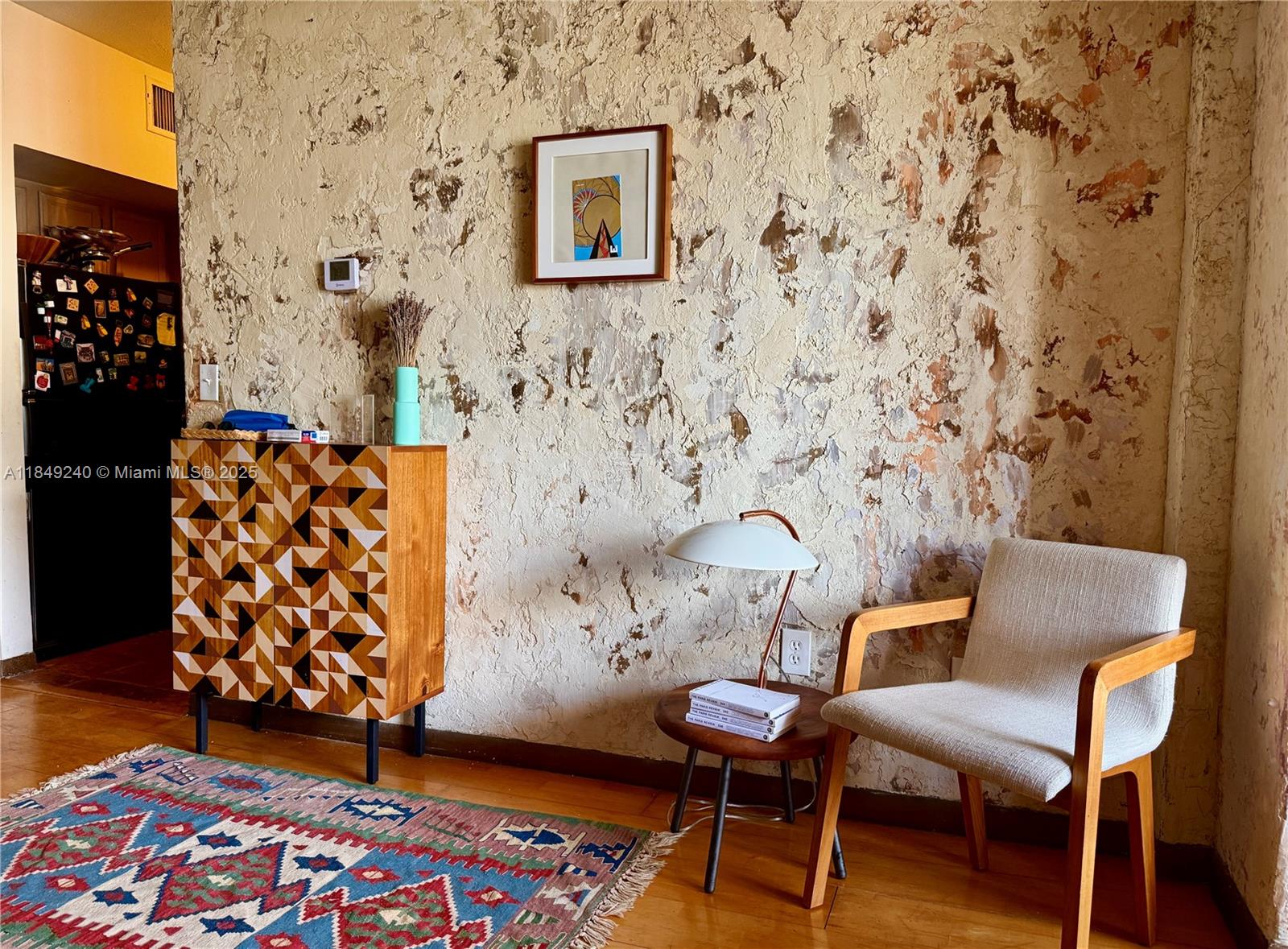 934 Michigan Avenue, Unit 304 Miami Beach, FL 33139 - Photo 5 of 30 a living room with furniture and wooden floor