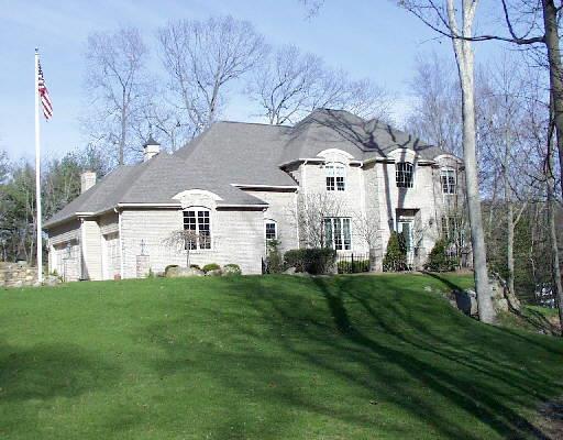 211 Davis Hill Road Weston, CT 06883 - Photo 1 of 1 a front view of house with yard and green space