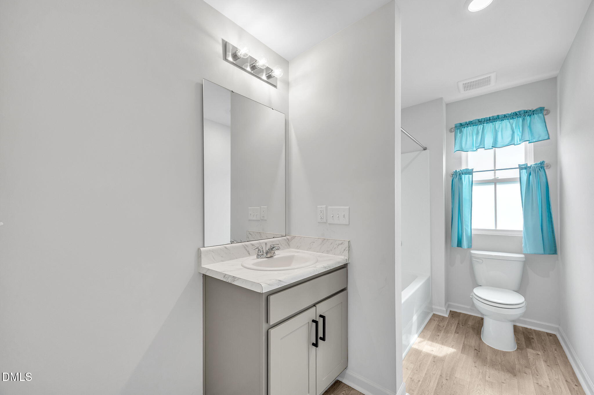 177 Yellowwood Avenue Spring Hope, NC 27882 - Photo 22 of 31 a bathroom with a toilet sink and mirror