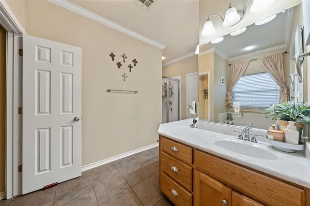 a bathroom with a sink a mirror and a shower