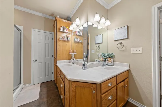 a bathroom with a sink a light fixture and a mirror