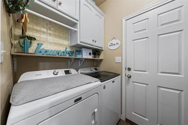 a utility room with dryer and washer