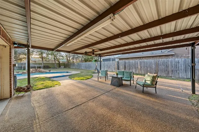 a view of a swimming pool with a lounge chairs