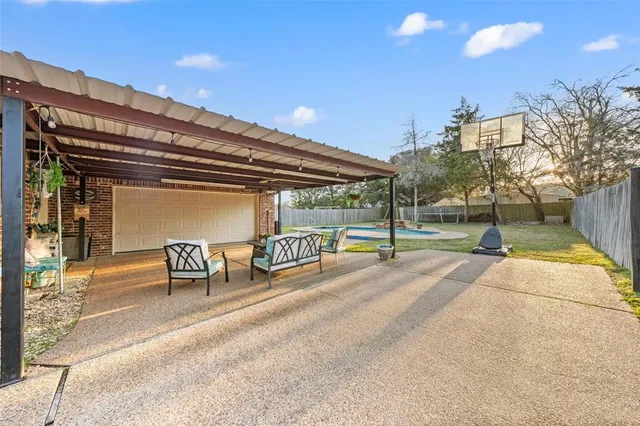 a view of a house with backyard porch and sitting area