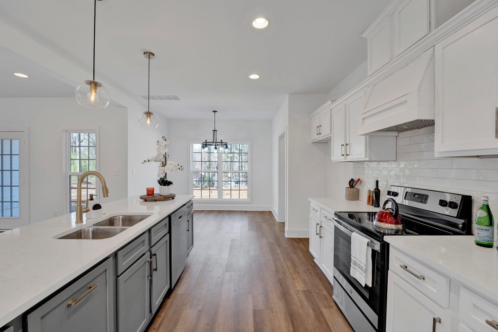5702 Spring Lake Road Memphis, TN 38135 - Photo 14 of 38 a kitchen with granite countertop a sink a counter space appliances and cabinets