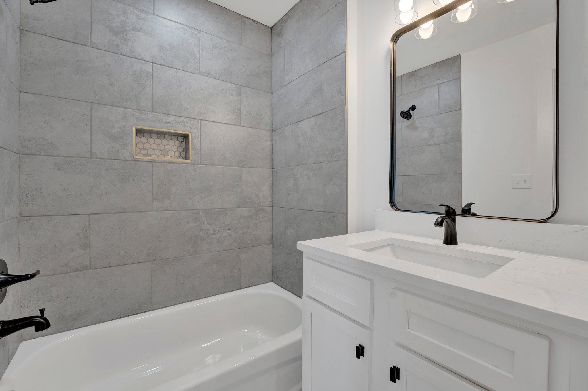 5702 Spring Lake Road Memphis, TN 38135 - Photo 34 of 38 a bathroom with a sink a toilet and shower