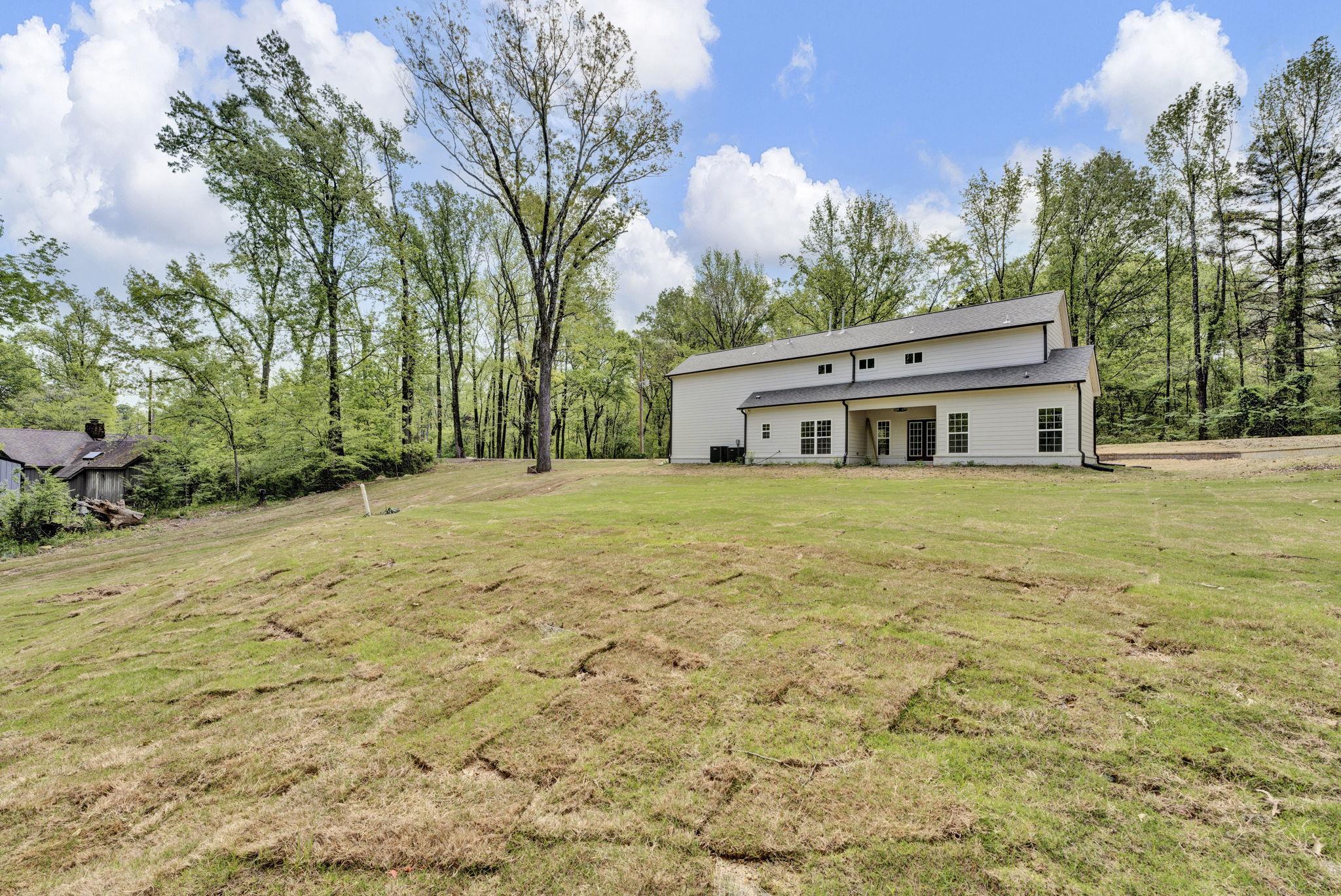5702 Spring Lake Road Memphis, TN 38135 - Photo 36 of 38 a house with yard in front of it