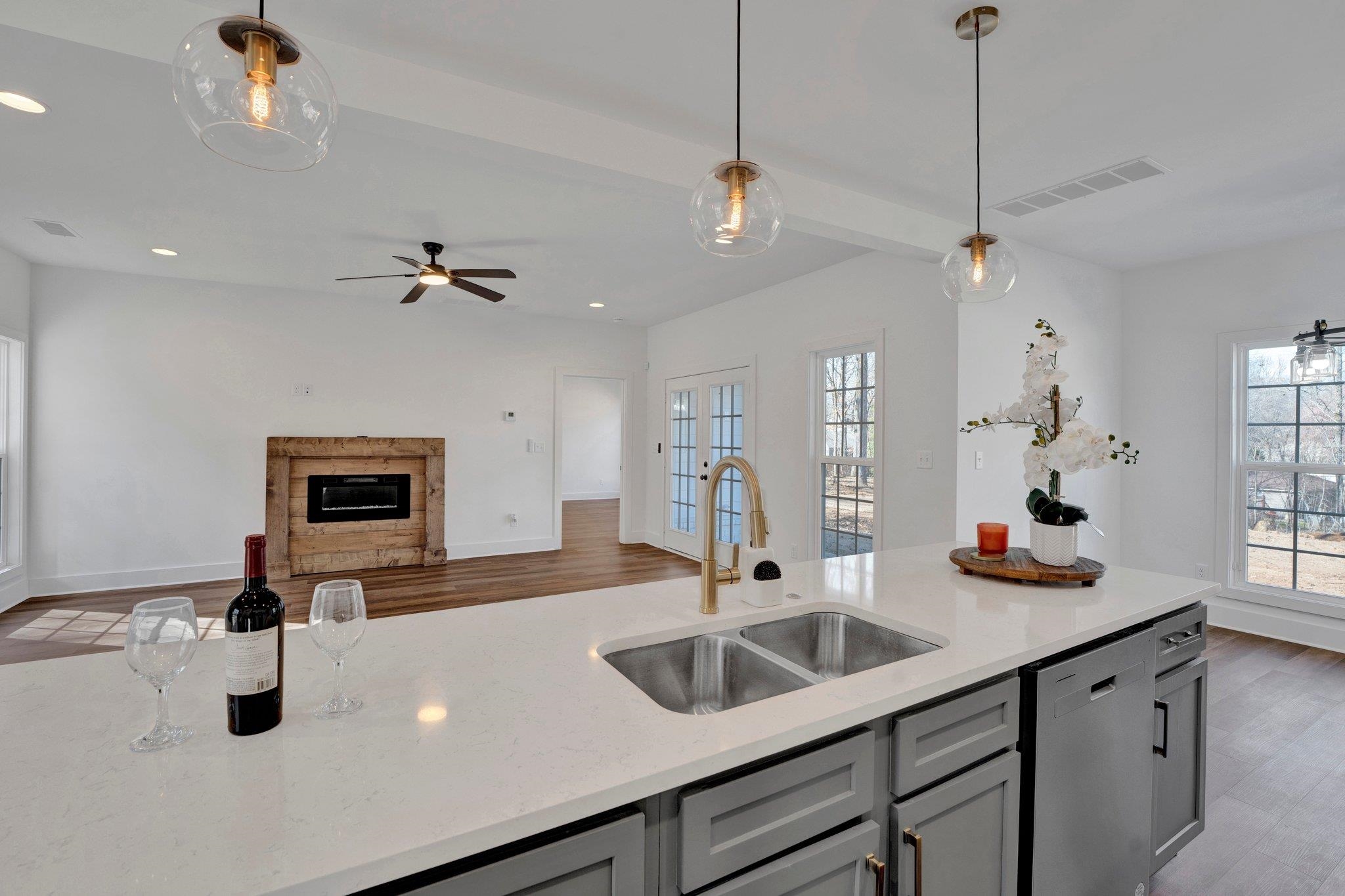 5702 Spring Lake Road Memphis, TN 38135 - Photo 9 of 38 a kitchen with sink a faucet and chairs