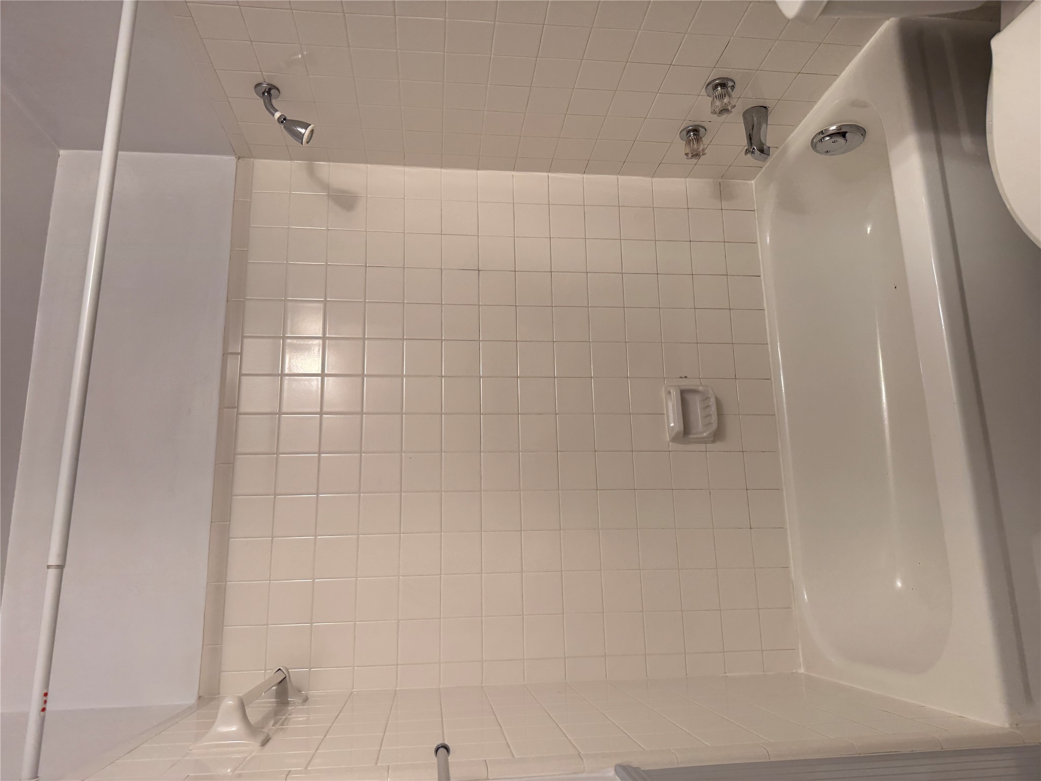 2907 Pearl Street, Unit 103 Austin, TX 78705 - Photo 12 of 20 a bathroom with a shower and a bath tub