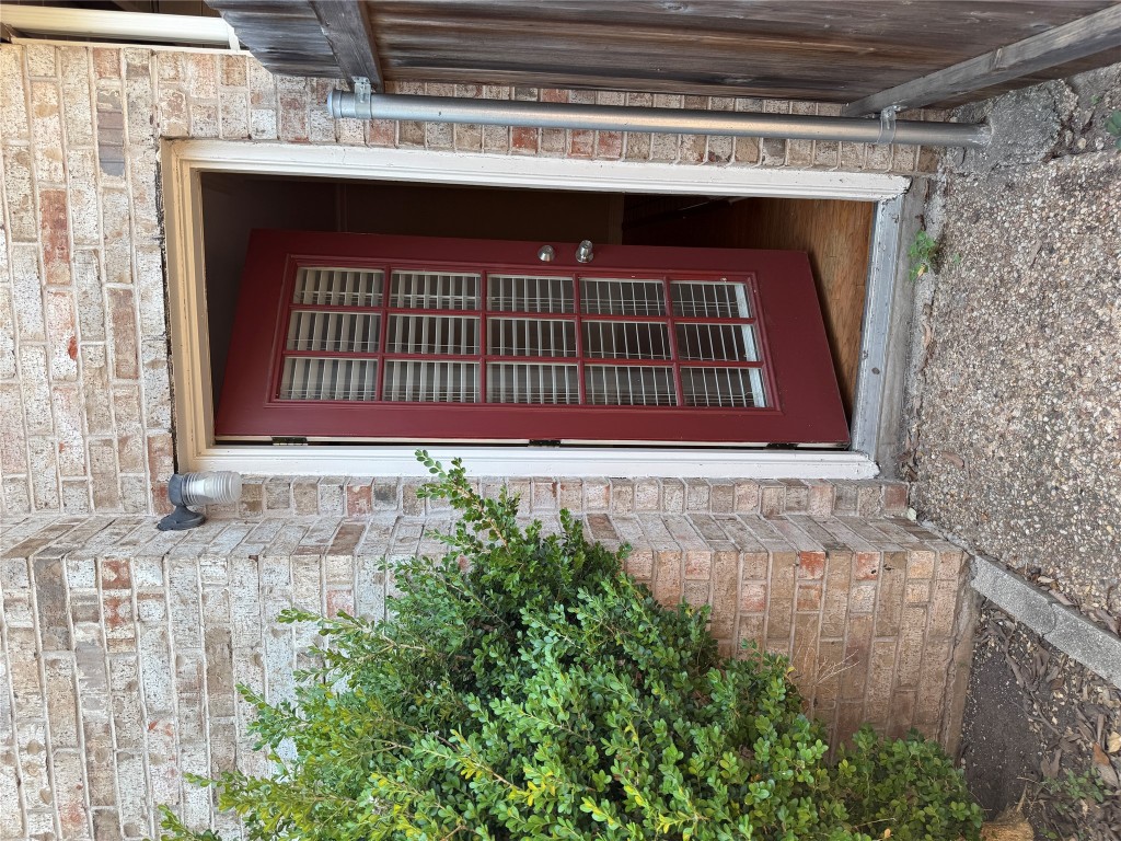 2907 Pearl Street, Unit 103 Austin, TX 78705 - Photo 17 of 20 a front view of a house with garden