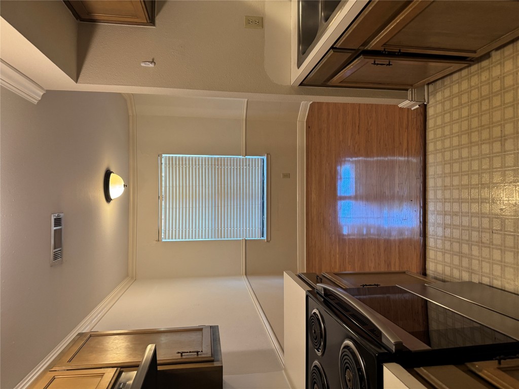 2907 Pearl Street, Unit 103 Austin, TX 78705 - Photo 19 of 20 a view of a kitchen cabinets and a stove top oven