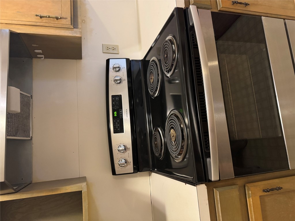 2907 Pearl Street, Unit 103 Austin, TX 78705 - Photo 20 of 20 a stove top oven sitting inside of a kitchen