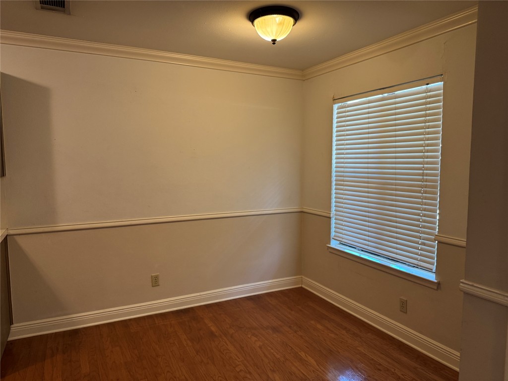 2907 Pearl Street, Unit 103 Austin, TX 78705 - Photo 3 of 20 a view of a small space with wooden floor and a window