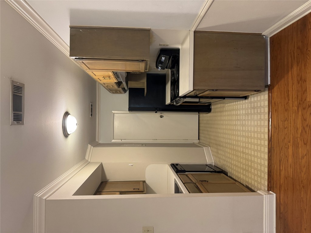 2907 Pearl Street, Unit 103 Austin, TX 78705 - Photo 4 of 20 a kitchen with stainless steel appliances granite countertop a sink stove and refrigerator