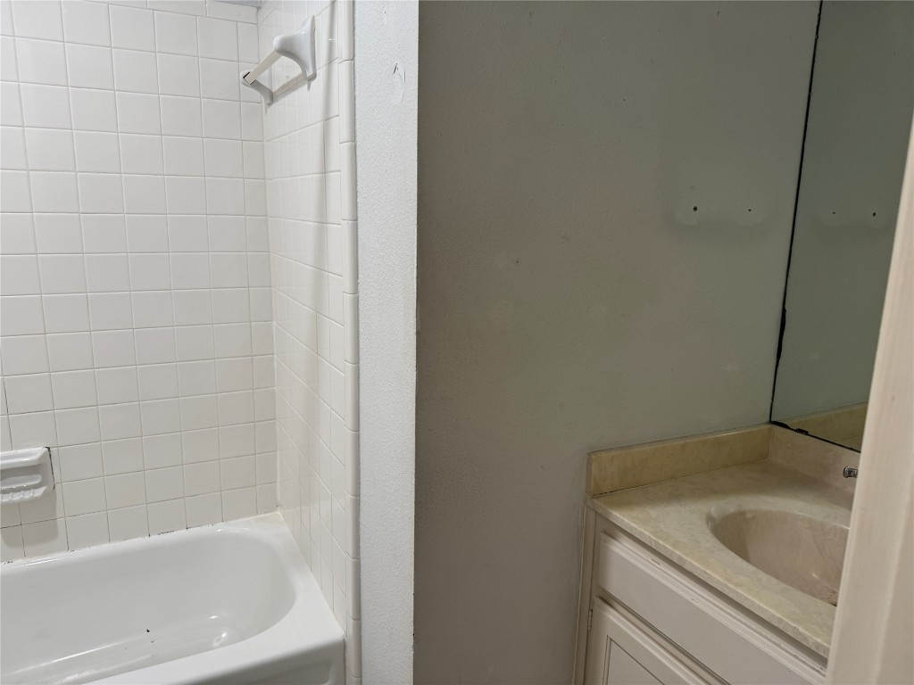 2907 Pearl Street, Unit 103 Austin, TX 78705 - Photo 8 of 20 a bathroom with a sink and bathtub