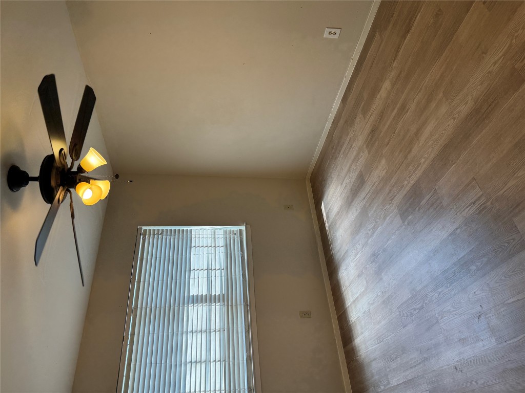2907 Pearl Street, Unit 103 Austin, TX 78705 - Photo 9 of 20 wooden floor in an empty room with a window