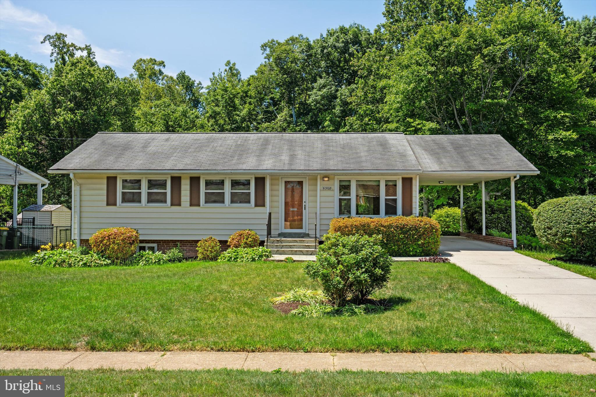 5308 Inverchapel Road Springfield, VA 22151 - Photo 1 of 28 Front view with attached carport and driveway