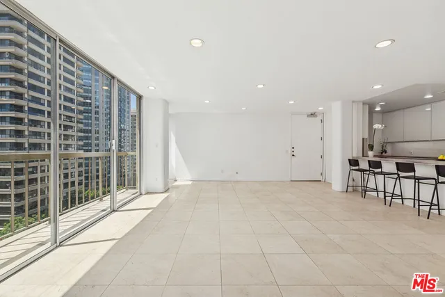 a view of an empty room with a fireplace