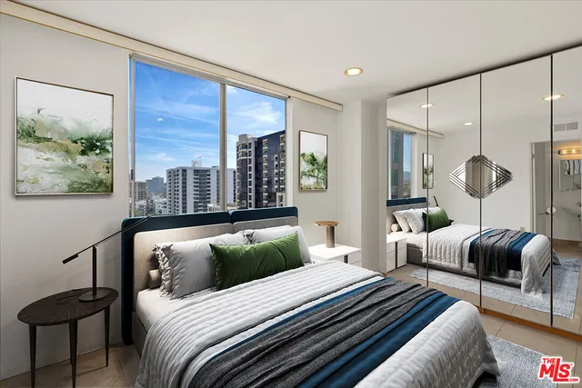 a bedroom with bed and a large window