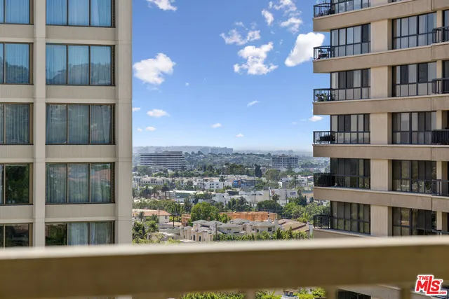 a view of an empty room with glass door and glass door