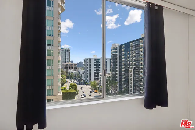 a bathroom with a sink toilet and a mirror