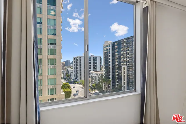a view of a bathroom with a shower and a toilet