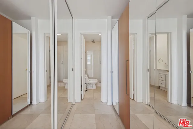 a bathroom with a sink vanity granite and a mirror