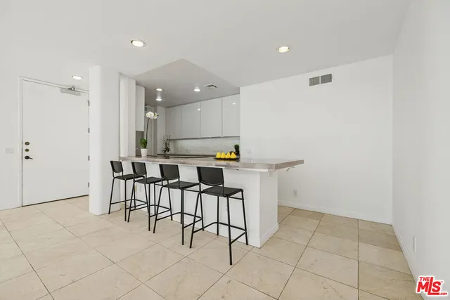 a kitchen with a sink cabinets and window
