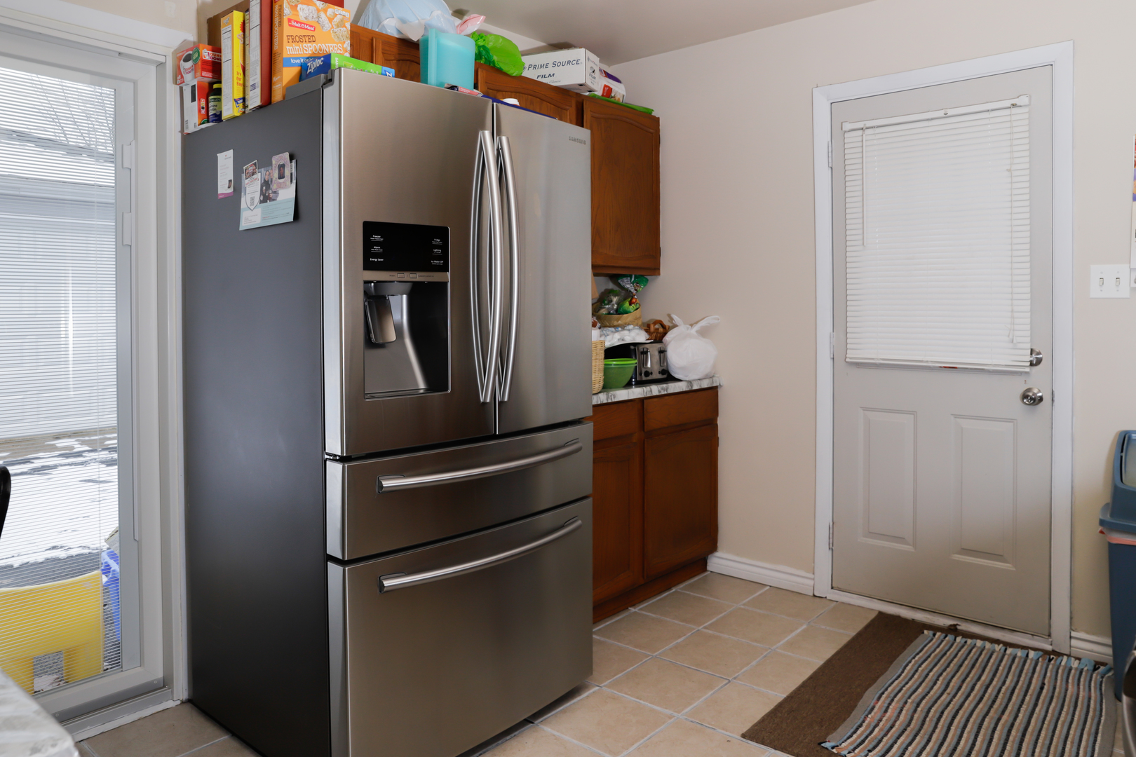 219 Hadleigh Road Bolingbrook, IL 60440 - Photo 14 of 18 a metallic refrigerator freezer sitting in a kitchen