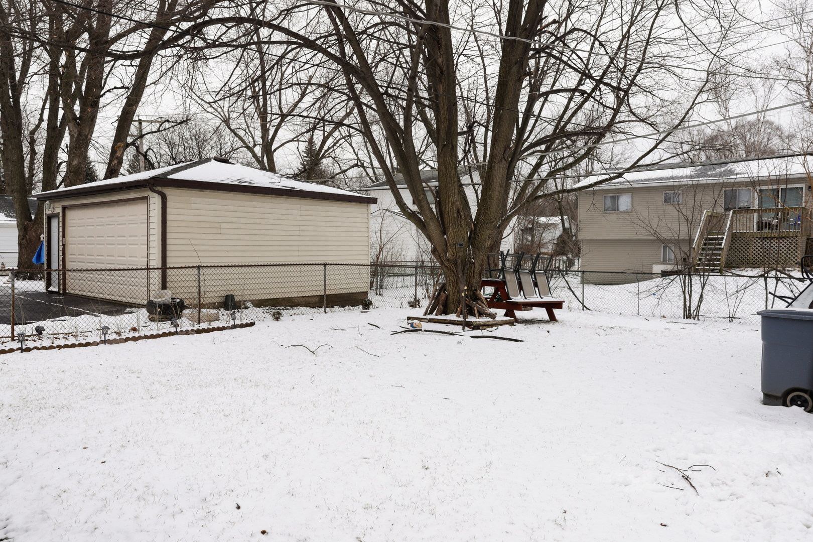 219 Hadleigh Road Bolingbrook, IL 60440 - Photo 8 of 18 a view of a house with snow on the road