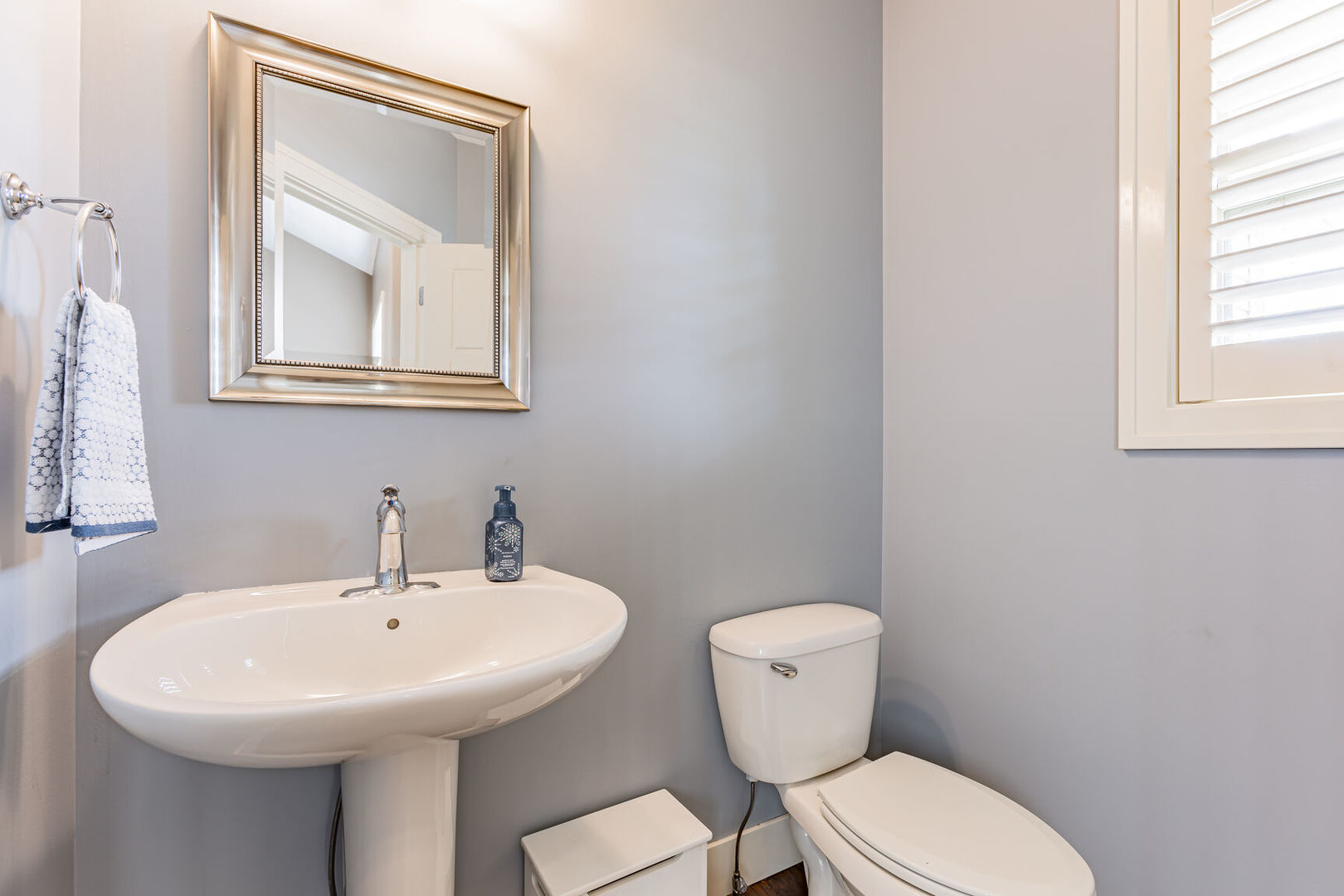 5 Fletcher Court Savoy, IL 61874 - Photo 16 of 48 a bathroom with a toilet a sink and mirror