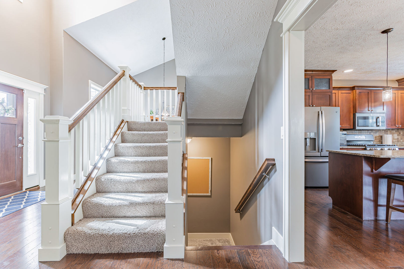 5 Fletcher Court Savoy, IL 61874 - Photo 20 of 48 a view of entryway and kitchen with wooden floor