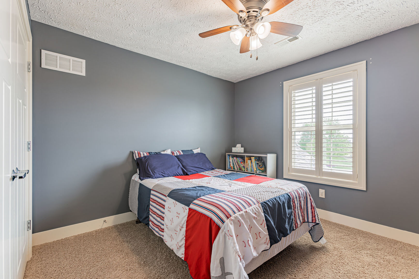 5 Fletcher Court Savoy, IL 61874 - Photo 27 of 48 a bedroom with a bed and a chandelier