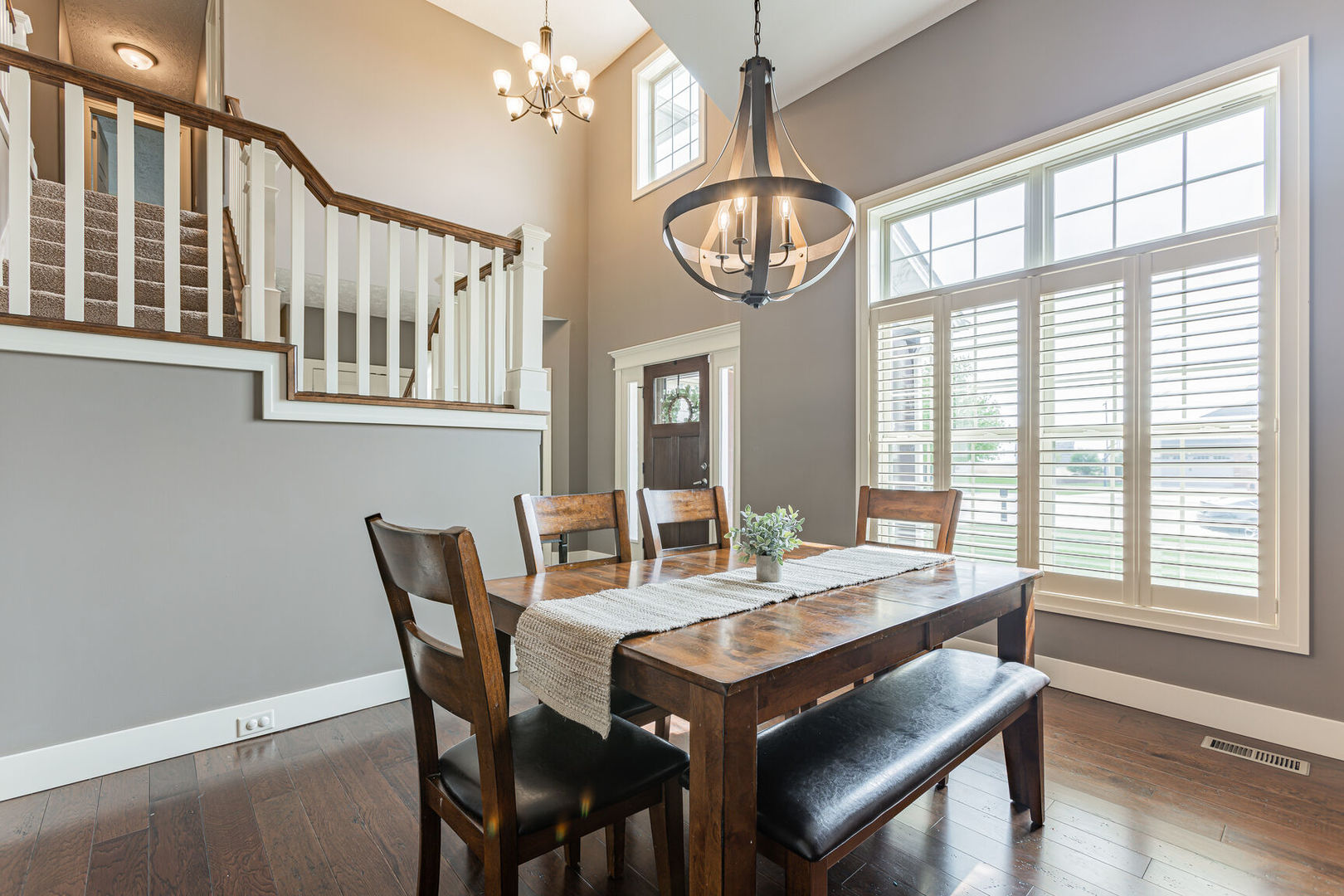 5 Fletcher Court Savoy, IL 61874 - Photo 3 of 48 a view of a dining room with furniture window and wooden floor