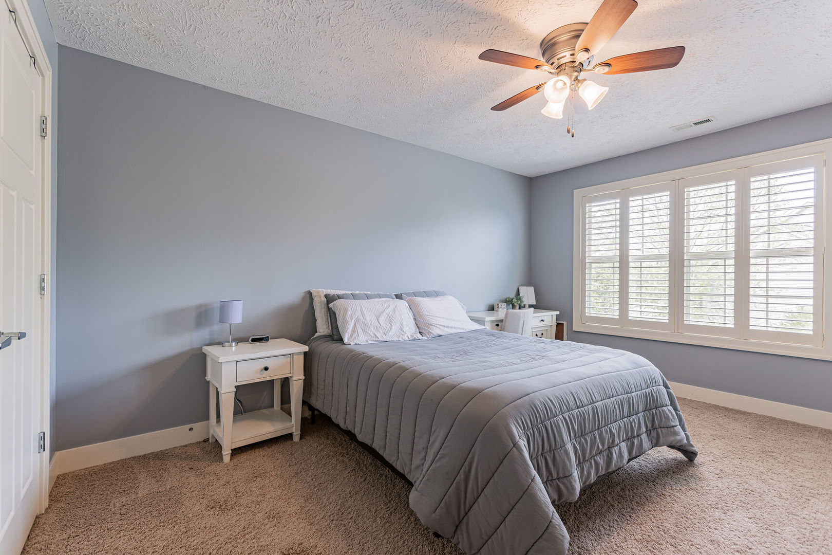 5 Fletcher Court Savoy, IL 61874 - Photo 33 of 48 a bedroom with a bed and a chandelier