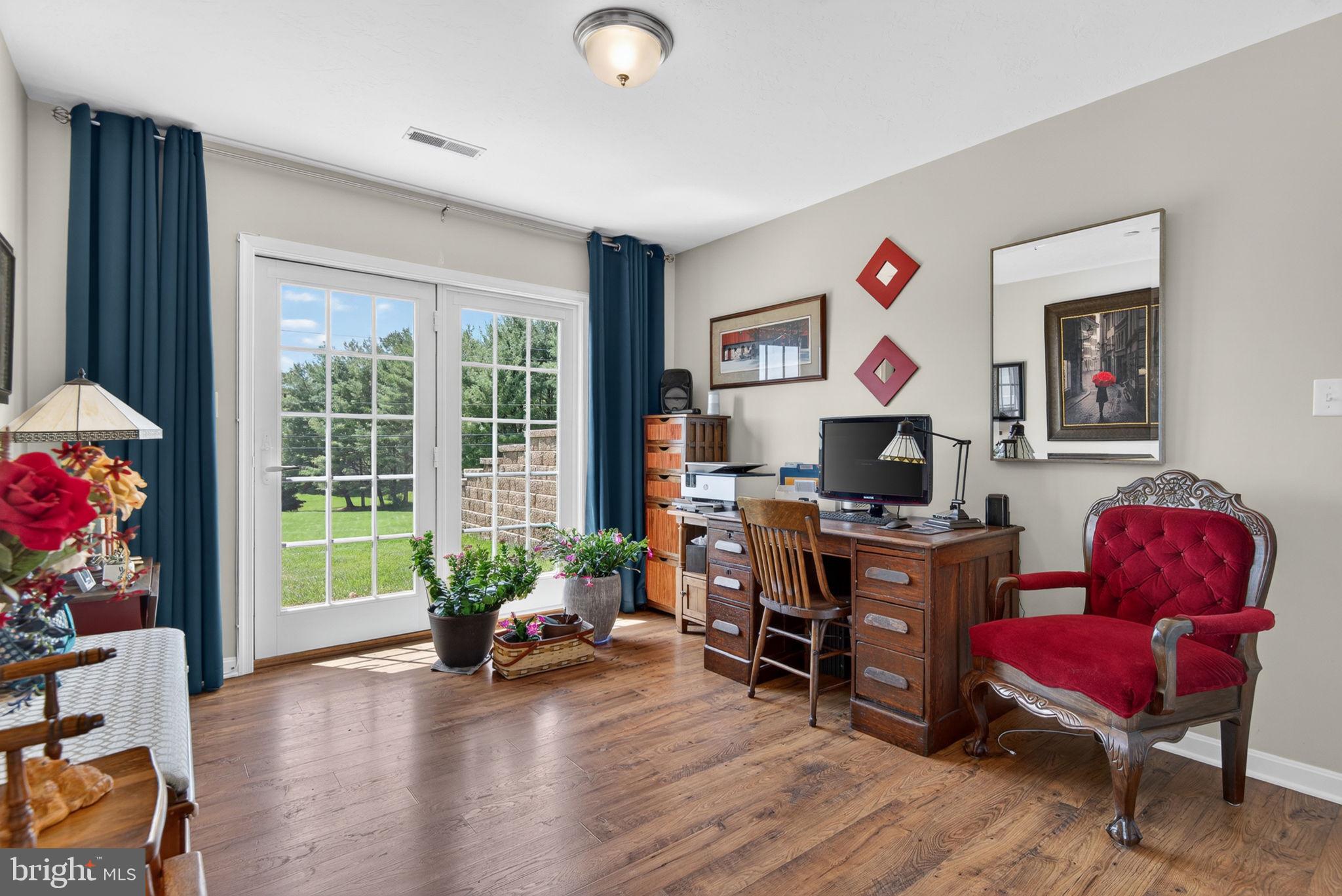 1332 Pleasant View Drive, Unit 75 Spring Grove, PA 17362 - Photo 18 of 26 a living room with furniture and a wooden floor