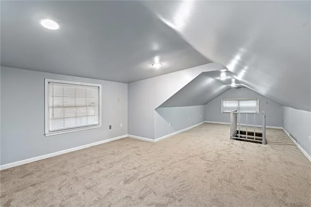 a view of parking and utility room